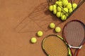 Rackets and basket tennis balls on clay court Royalty Free Stock Photo