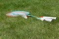 Rackets and a shuttlecock for badminton on the grass. Royalty Free Stock Photo