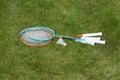 Rackets and a shuttlecock for badminton on the grass. Royalty Free Stock Photo