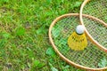 Rackets and a shuttlecock for badminton on the grass Royalty Free Stock Photo
