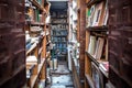 Racks with books in old abandoned library