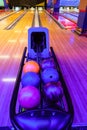 Racks with bowling balls. Bowling ball return system in bowling hall