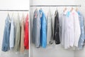 Racks with clean clothes after dry-cleaning Royalty Free Stock Photo