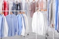 Racks with clean clothes on hangers Royalty Free Stock Photo