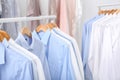 Racks with clean clothes on hangers Royalty Free Stock Photo