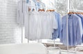 Racks with clean clothes on hangers Royalty Free Stock Photo