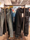 Racks with jeans in a clothing store