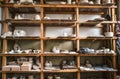 Racks in a pottery workshop in which there are potter