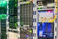 Racks with servers are installed in the server room of the data center. Multiple optical wires connect to the central router. The Royalty Free Stock Photo