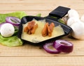 Raclette pan with cheese and sausages - party food