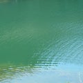 Emerald lake in an abandoned career in the village Racos, Transylvania Royalty Free Stock Photo