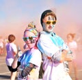 Rad couple posing after running a color race