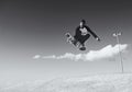 A rad day at the skate park. Monochrome shot of a young man doing tricks on his skateboard at the skate park. Royalty Free Stock Photo