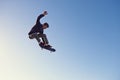 A rad day at the skate park. A young man doing tricks on his skateboard at the skate park. Royalty Free Stock Photo