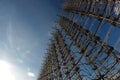 Radar arc in Chernobyl. Old collapsing radar antenna on sky background