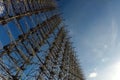 Radar arc in Chernobyl. Old collapsing radar antenna on sky background