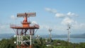 Radar communication tower plane in blue sky background. Royalty Free Stock Photo