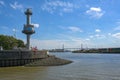 Radar tower with water level indicator at the Steinwerder coal ship harbor in the cargo port of Hamburg, Koehlbrand Bridge over Royalty Free Stock Photo