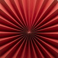 Radial pattern with a symmetrical design created by folding red paper. The folds Royalty Free Stock Photo