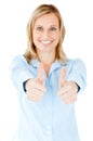 Radiant businesswoman smiling with thumbs up