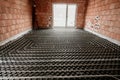 Radiant floor construction installation with flexible pipes. Installation of underfloor heating Royalty Free Stock Photo