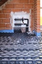 Radiant floor heating hydronic manifold with flexible tubing.