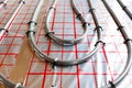 Radiant floor heating pipe installation in modern building Royalty Free Stock Photo
