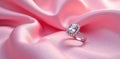 A radiant gemstone ring, elegantly displayed on soft pink silk, symbolizes enduring love and commitment. Generative AI Royalty Free Stock Photo