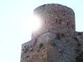 The radiant sun dazzling the castle tower, Benabarre, Huesca, Spain, Europe