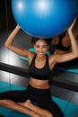 a radiant young black woman smiling brightly at Pilates class Royalty Free Stock Photo