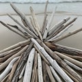 A radiating arrangement of driftwood pieces Royalty Free Stock Photo