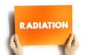 Radiation is energy that comes from a source and travels through space at the speed of light, text concept on card Royalty Free Stock Photo