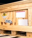 Radiation label beside the transport wooden box Type A package