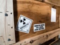 Radiation label beside the transport wooden box Type A package