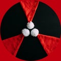 Radiation sign making up of three Santa`s caps. Threat of radioactive disease in the new year, environmental pollution,