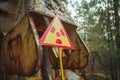 Radiation Sign - triangular warning yellow sign of radiation hazard in the zone of radioactive fallout in Pripyat city