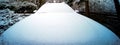 Radiator bonnet and windscreen of an SUV after a light snowfall, wide-angle view