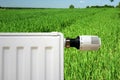 Radiator on a green field Royalty Free Stock Photo