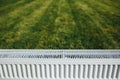 Radiator on green lawn, ecological heating concept