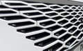 Radiator grille pattern. Car radiator grill close up. Chrome grill of big powerful car engine