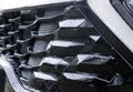 Radiator grille pattern. Car radiator grill close up with water drops. Chrome grill of big powerful car engine