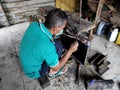 Radiator repairman when cleaning and repairing broken radiators in old cars