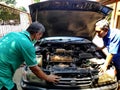 Radiator repairman when cleaning and repairing broken radiators in old cars