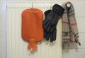 Radiator, warming bottle,scarf and and warm gloves, shortage of heating gas due to the embargo of russian oil and gas in europe, s