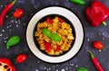 Radiatori pasta with chicken and peppers on dark background. Top view Royalty Free Stock Photo