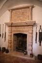 Radim castle interior, grand hall of renaissance chateau, room with marble hearth and gothic large historical stone fireplace,