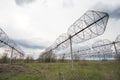 Radio astronomy observatory radio telescope construction in the fields in early spring in cloudy weather