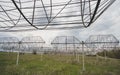 Radio astronomy observatory radio telescope construction in the fields in early spring in cloudy weather