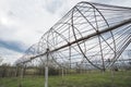 Radio astronomy observatory radio telescope construction in the fields in early spring in cloudy weather