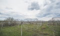 Radio astronomy observatory radio telescope construction in the fields in early spring in cloudy weather